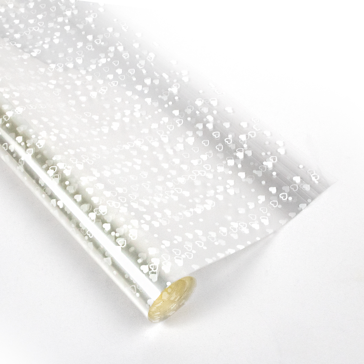 Papel celofan con diseño de patrón de corazones blancos